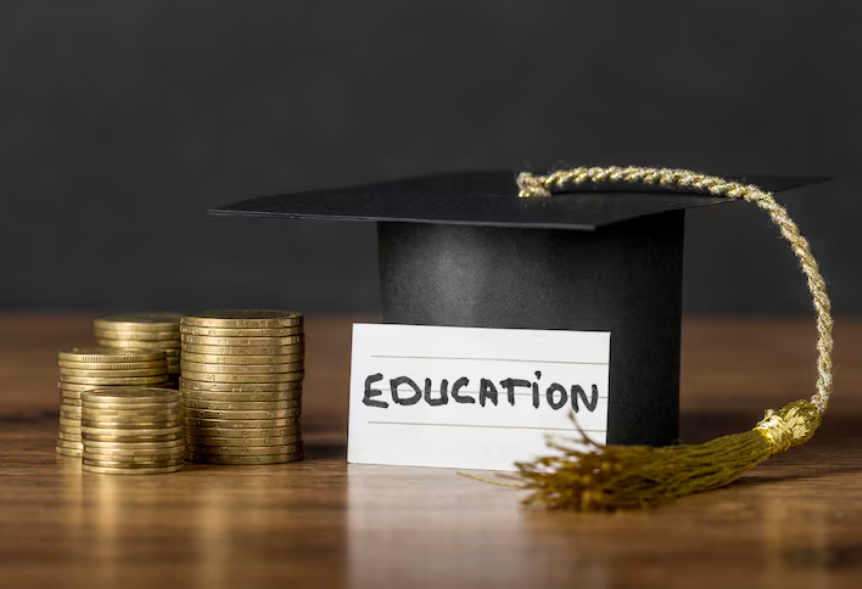 how student loans work now shown with graduation cap and stacked coins