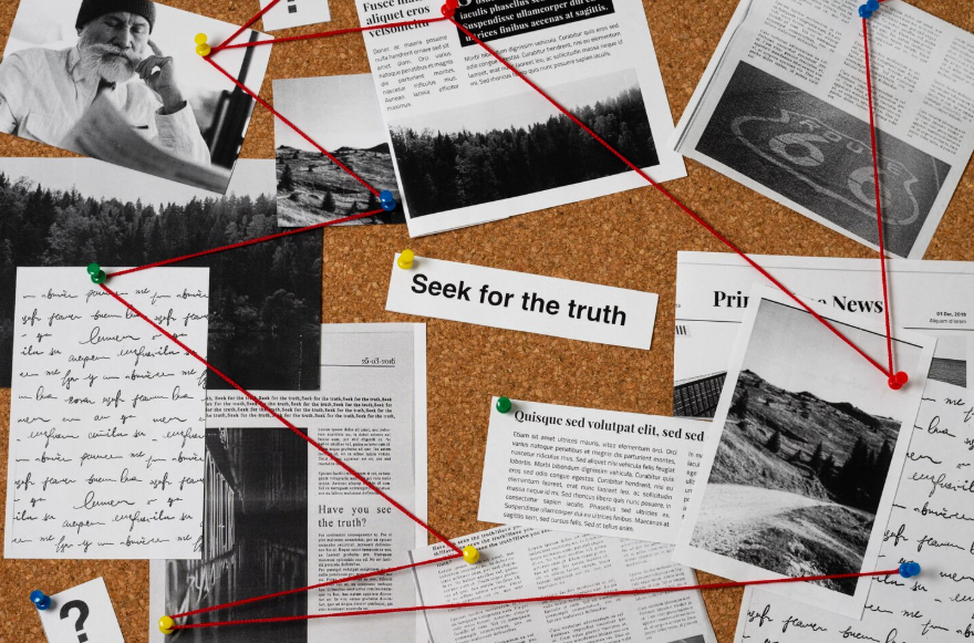 why people believe conspiracy theories shown through connected notes and headlines